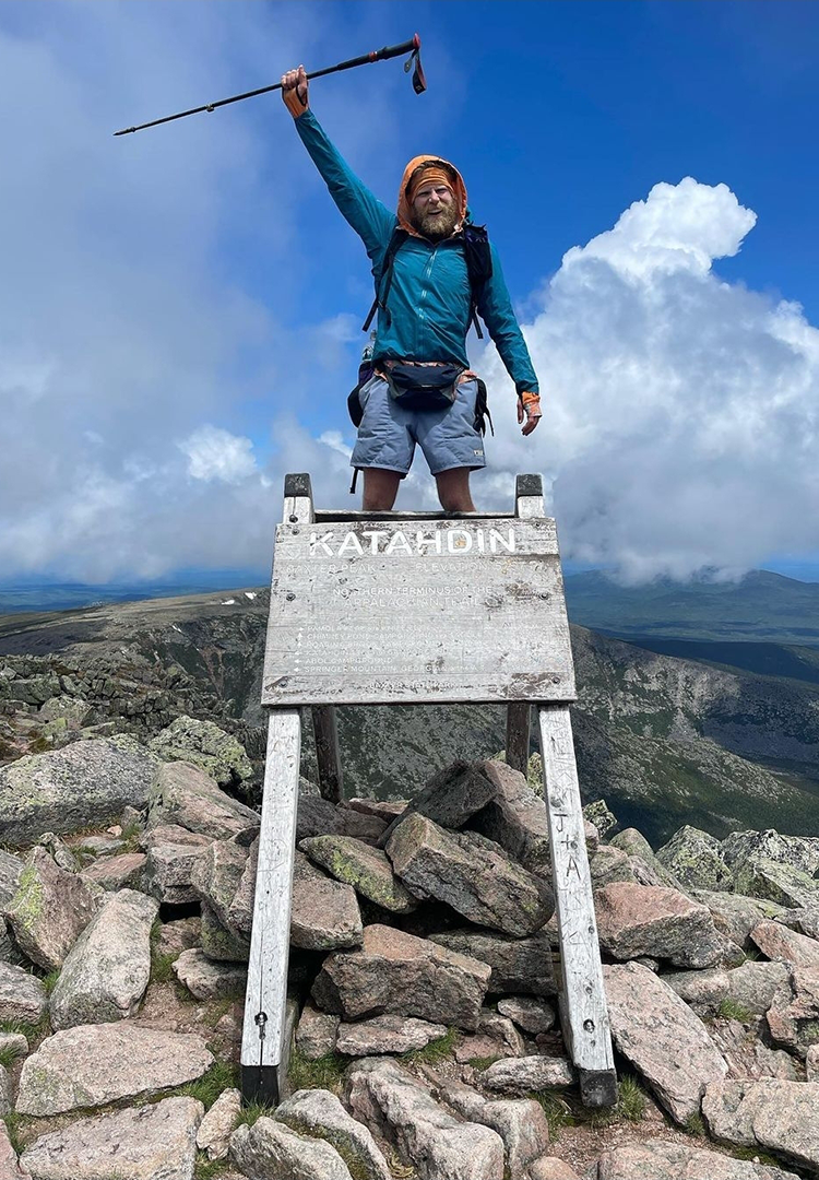 Backpacker puts a Bear Vault Bear Canister into a ULA CDT Backpack