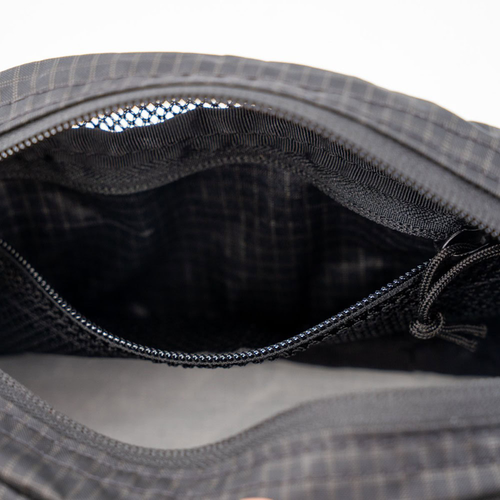 ULA Toiletry Kit unzipped and showing the interior zippered pocket.