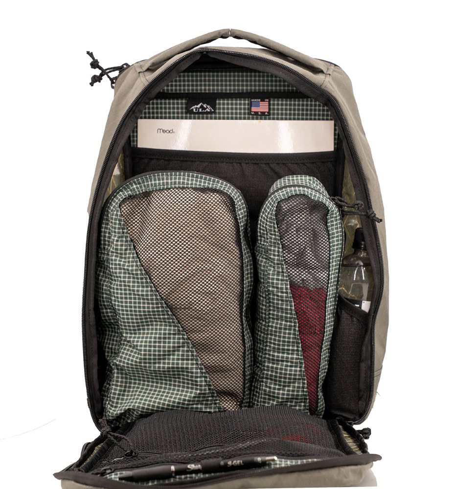 X50 Cicada Daypack Front View pack is open and image shows items stored neatly inside