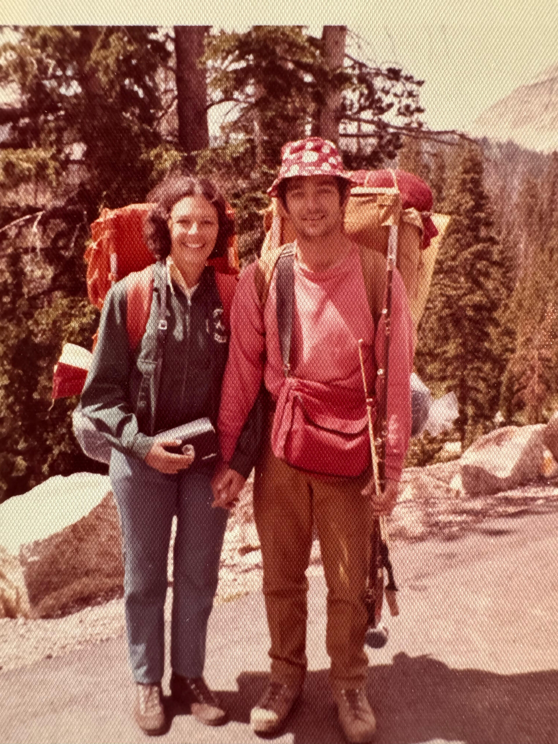 A man and woman pose while on a backpacking trip in 1968