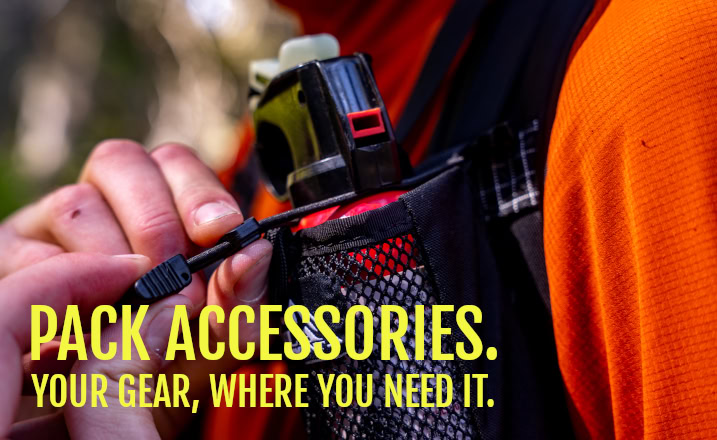 Image says: ULA Pack Accessories: Your gear, where you need it. Image shows a Hiker pulling a bear spray out of his ULA Deploy bear spray holder.