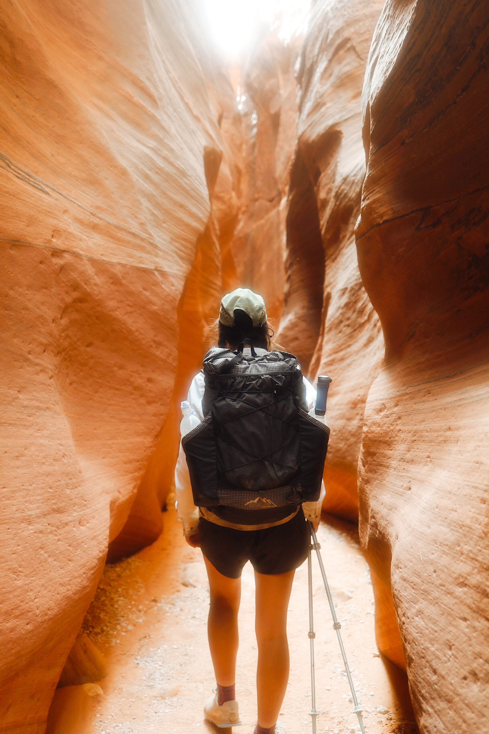 A woman backpacking with a ULA Nexus pack