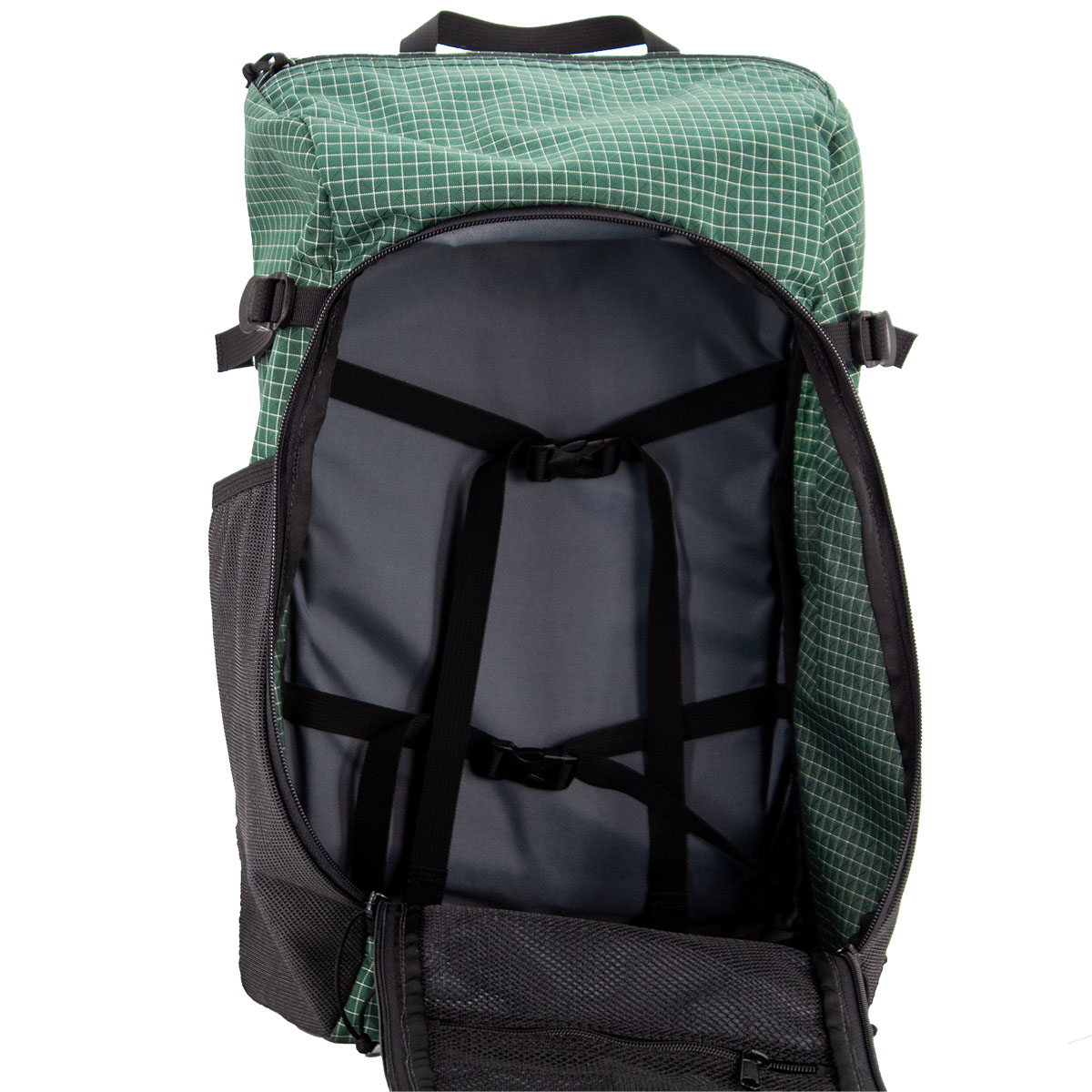 ULA Dragonfly in Green Robic Open to show dual interior compression straps and front mesh organizer pockets